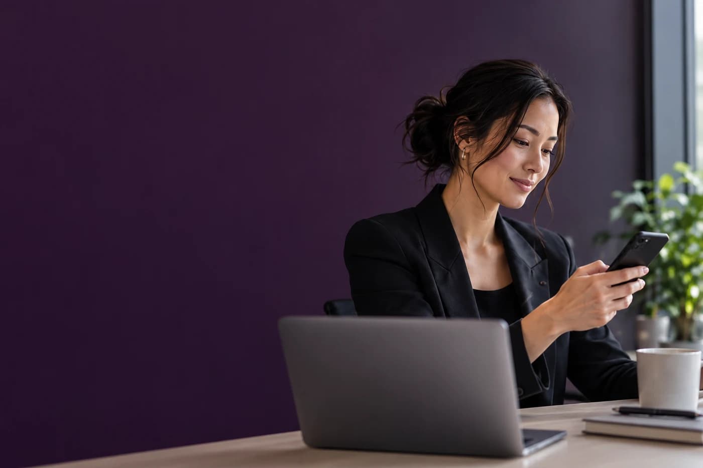 A professional reviewing her next task on a phone.
